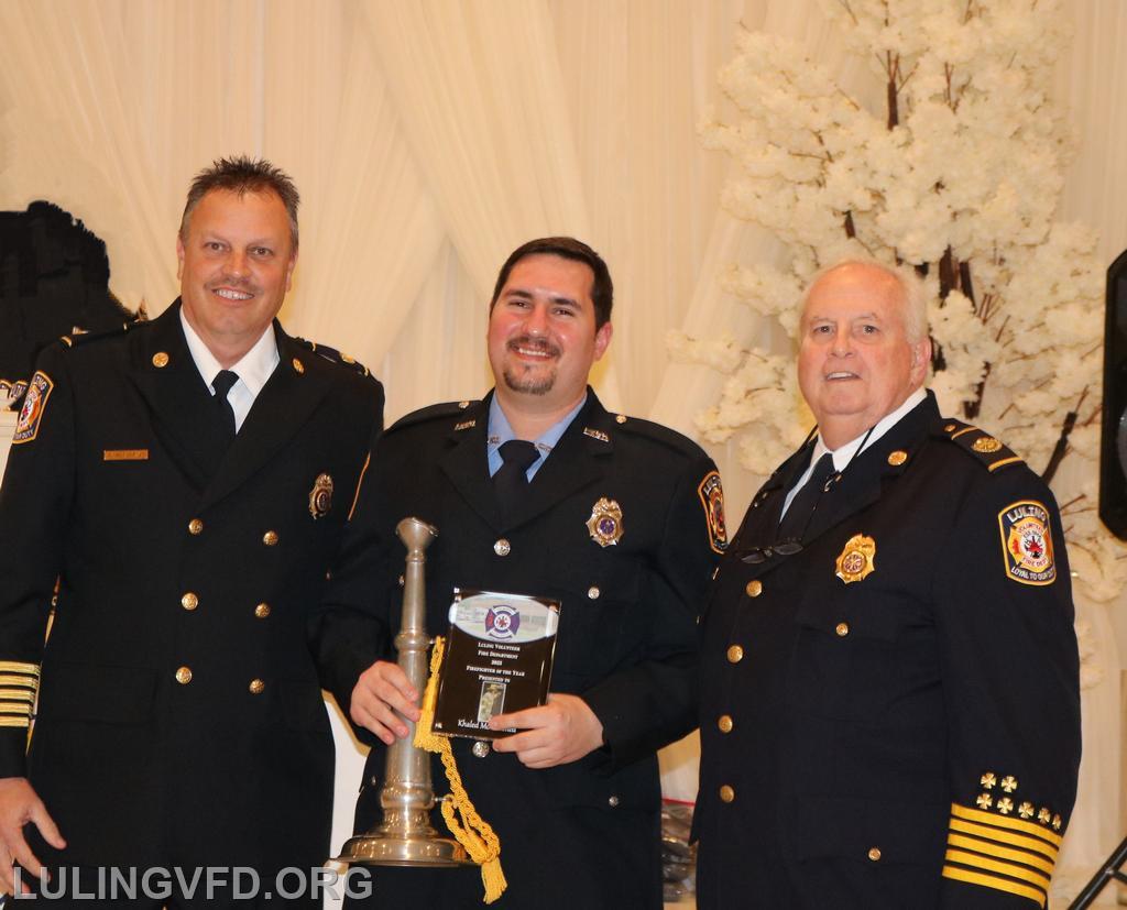 Firefighter of the Year Khaled Mohammed (center)